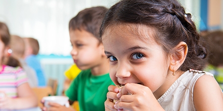 Cute little children drinking milk